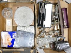 A mixed collection of metal ware items to include Candlesticks, place mats, Claret Jug, Condiment
