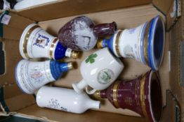 A collection of Wade Whisky & Spirt Decanters to include Bells, Norfolk Gin, Tullamore Dew, etc .