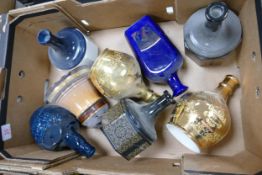 A collection of Wade Whisky & Spirt Decanters to include Bells, Glenfiddich , Chivas . These items
