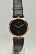 A VINTAGE LADYS GOLD PLATED QUARTZ GUCCI WRISTWATCH, round black dial signed Gucci, case width