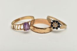 THREE 9CT GOLD RINGS, the first set with an oval amethyst and openwork shoulders, the second a