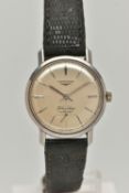 A LONGINES FLAGSHIP AUTOMATIC WRISTWATCH, the circular face in a light gold colour, with baton