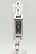 A GUCCI DIAMOND SET WRISTWATCH, the black rectangular dial signed 'Gucci Swiss Made', diamond dot