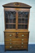 A GEORGIAN MAHOGANY AND CROSSBANDED SECRETAIRE BOOKCASE, the top with a domed top, double astragal