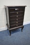 A 20TH CENTURY MAHOGANY SHEET MUSIC CABINET, with six fall front drawers, on cabriole legs, width