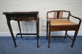 A 20TH CENTURY MAHOGANY FOLD OVER GAMES TABLE, the fold over top enclosing a green baize, with a