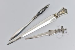 AN ELIZABETH II SILVER AND PARCEL GILT LETTER OPENER, the short handle cast in relief with a