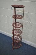 A BURGUNDY PAINTED CAST ALUMINIUM SIX TIER PAN STAND, of a tapered form, on paw feet, height