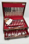 A 'BUTLER' CANTEEN, twelve person place setting of kings pattern cutlery, including meat carving