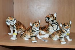 A GROUP OF LOMONOSOV TIGERS, comprising a large recumbent tiger, height 17cm x length 30cm (remnants