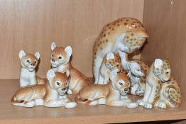 A GROUP OF LOMONOSOV LEOPARDS AND LION CUBS, comprising a large recumbent leopard, height 18cm,