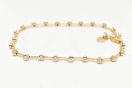 A DIAMOND LINE BRACELET, yellow metal line bracelet, twenty three round brilliant cut diamonds,