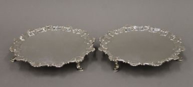 A pair of small George II silver salvers. 18 cm diameter. 17.9 troy ounces.