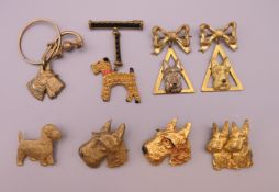 Eight 1930s gilt metal Scottie dog form brooches. Double Scottie dog brooch 3.5 cm high.
