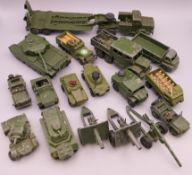 A quantity of various die cast military vehicles and cannons, including Dinky and Matchbox.