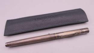 A Yard-O-Led silver fountain pen together with a Yard-O-Led leather pen case. Pen 14 cm long.