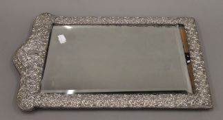 A large silver framed strut mirror. 49.5 cm high.