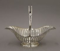 A silver basket. 29.5 cm long. 16.3 troy ounces.