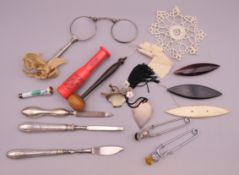 A quantity of miscellaneous items, including lorgnettes, an enamel cigarette holder, etc.
