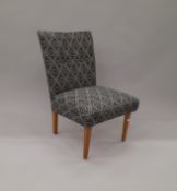 An early 20th century black and white upholstered bedroom chair. 46 cm wide.