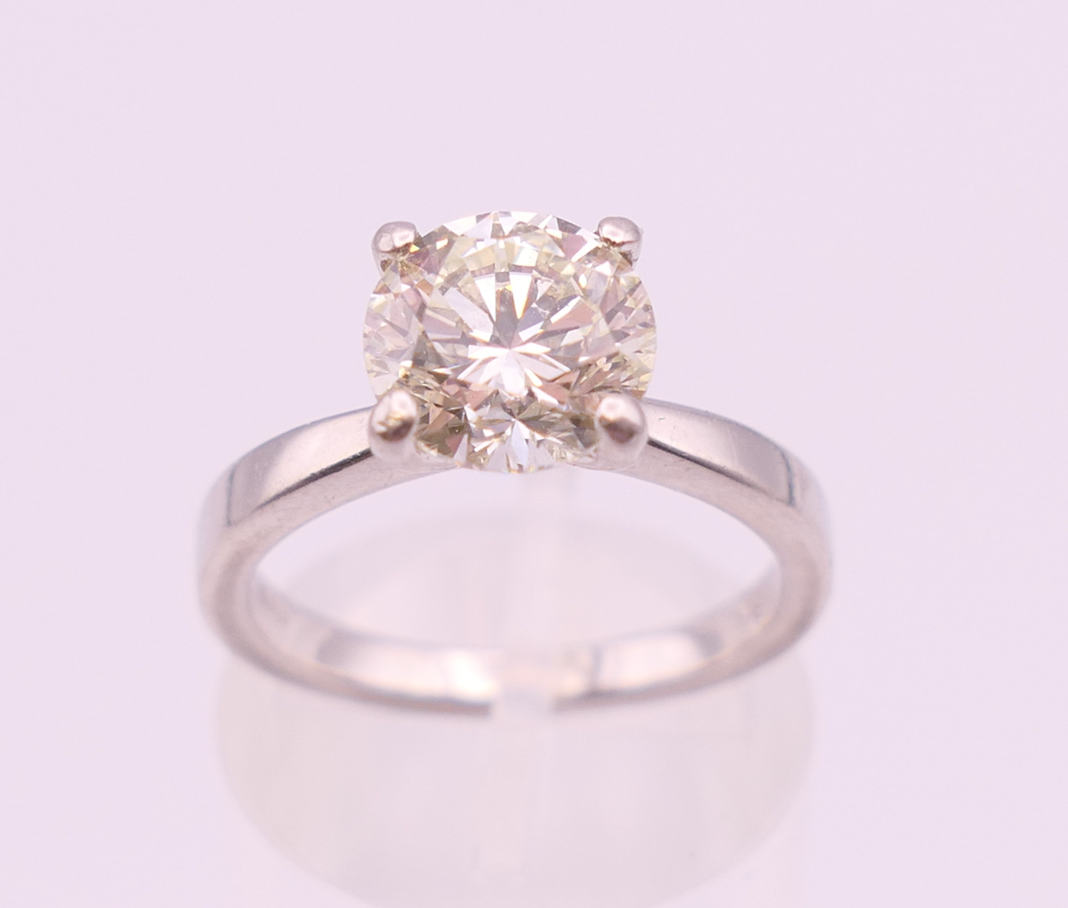A platinum diamond solitaire ring, the stone approximately 1.9 carats. Ring size L.