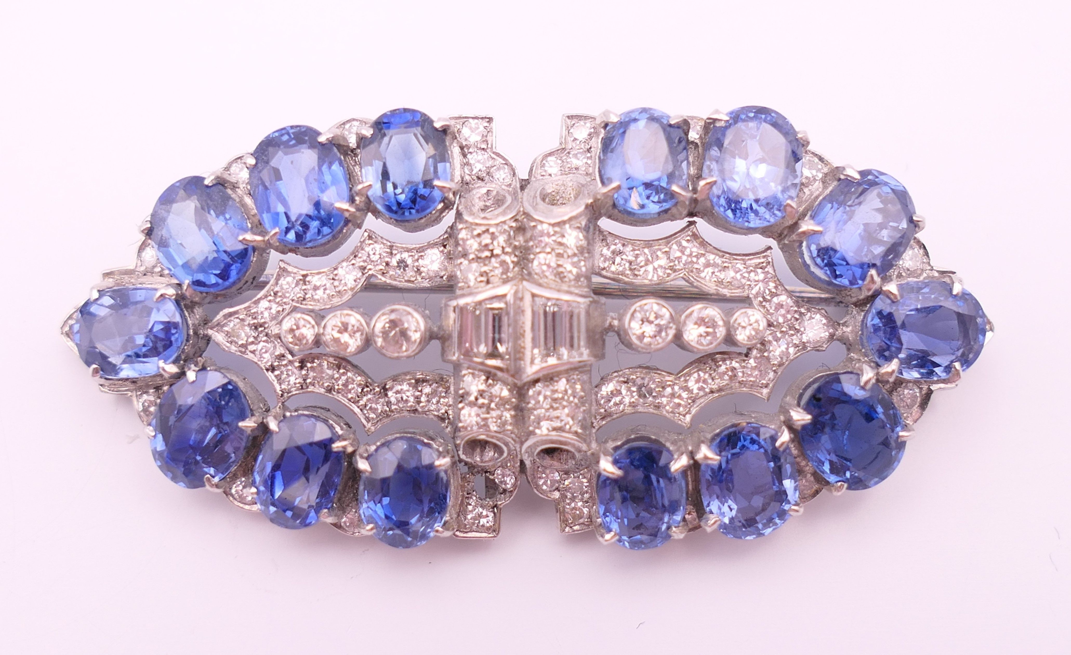An unmarked Garrard and Co Ltd sapphire and diamond brooch, cased. 5 cm x 2 cm. - Image 2 of 19