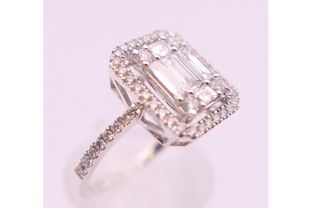 An 18 ct white gold ring with 5 baguette cut diamonds surrounded by numerous brilliant cut diamonds. - Image 4 of 8