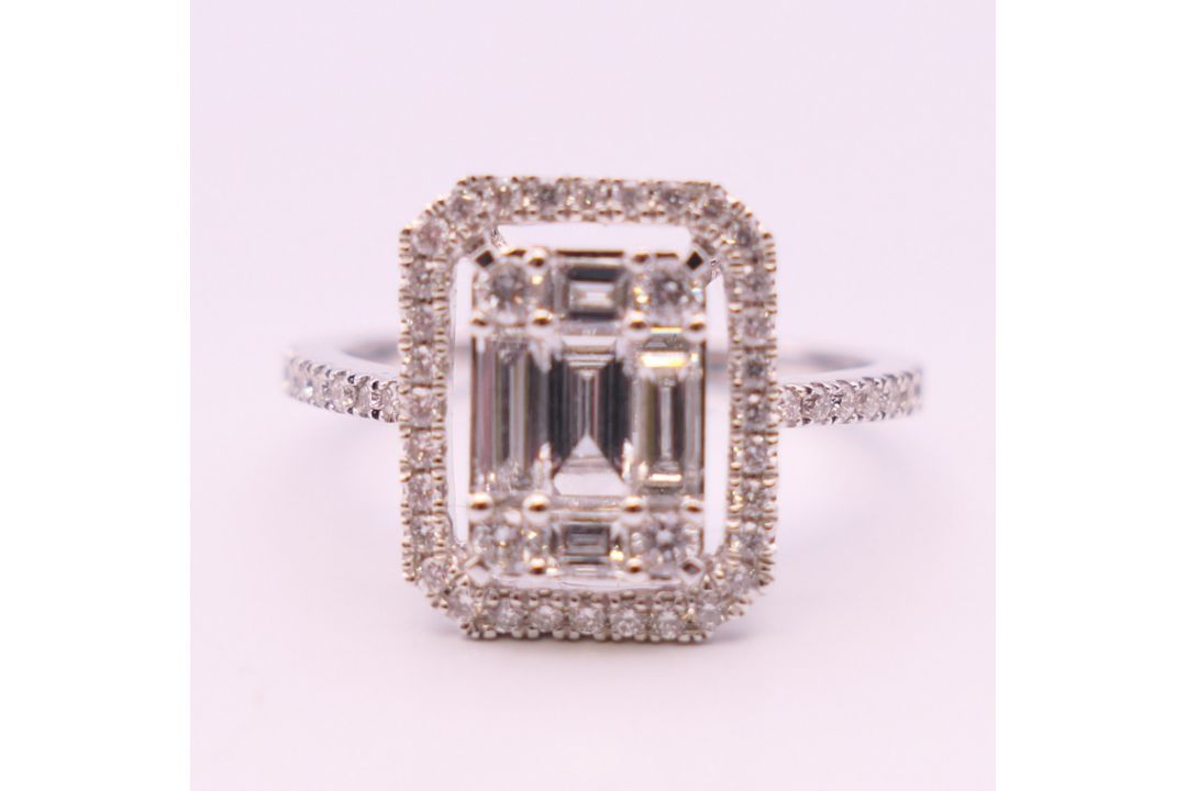 An 18 ct white gold ring with 5 baguette cut diamonds surrounded by numerous brilliant cut diamonds. - Image 2 of 8