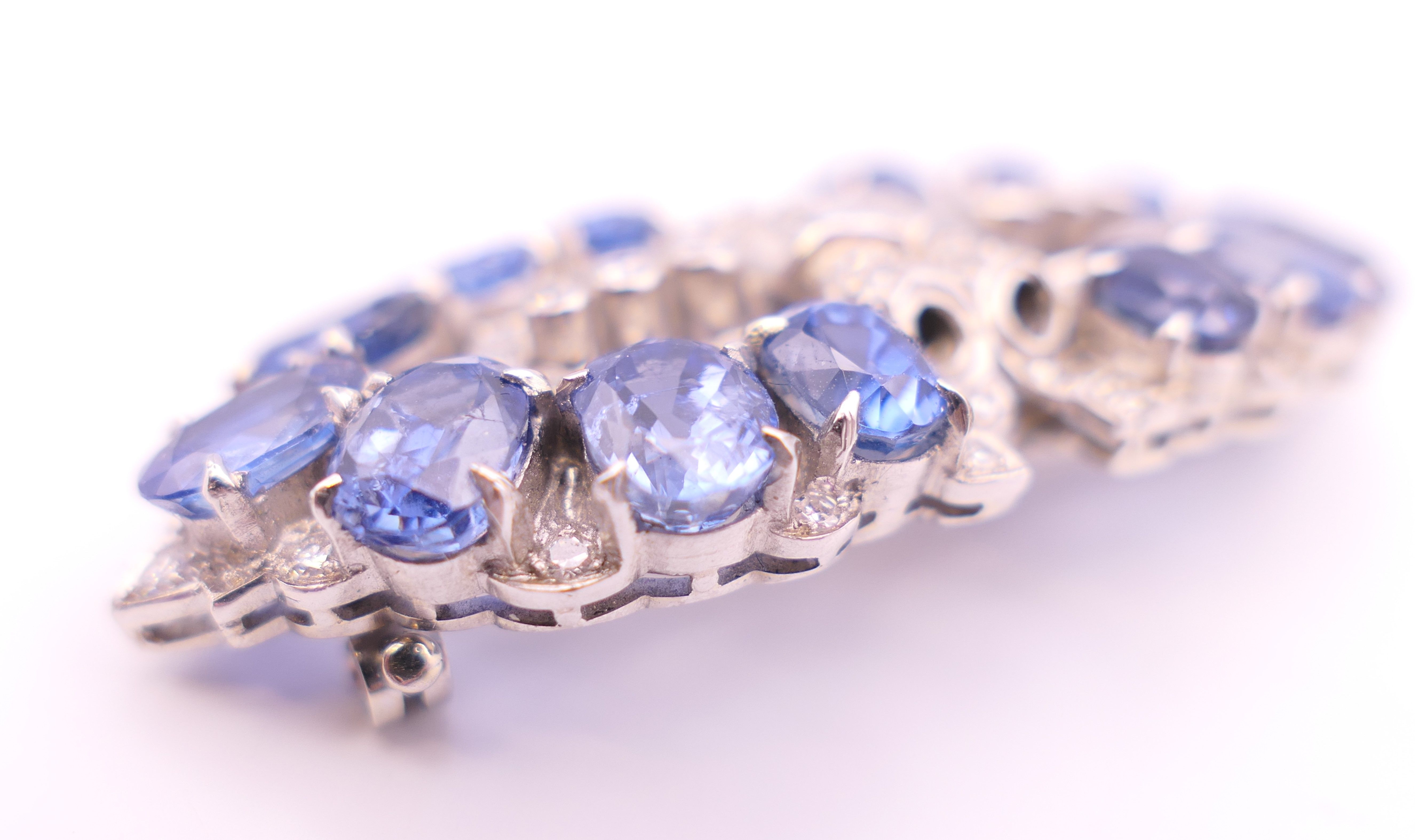 An unmarked Garrard and Co Ltd sapphire and diamond brooch, cased. 5 cm x 2 cm. - Image 9 of 19