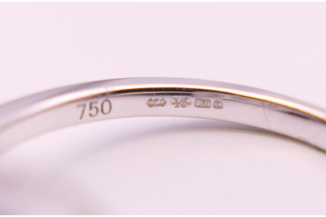 An 18 ct white gold ring with 5 baguette cut diamonds surrounded by numerous brilliant cut diamonds. - Image 8 of 8