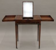 A 19th century mahogany gentleman's fold over dressing table. 63 cm wide.