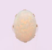 An 18 ct gold opal cabochon ring. Ring size I.