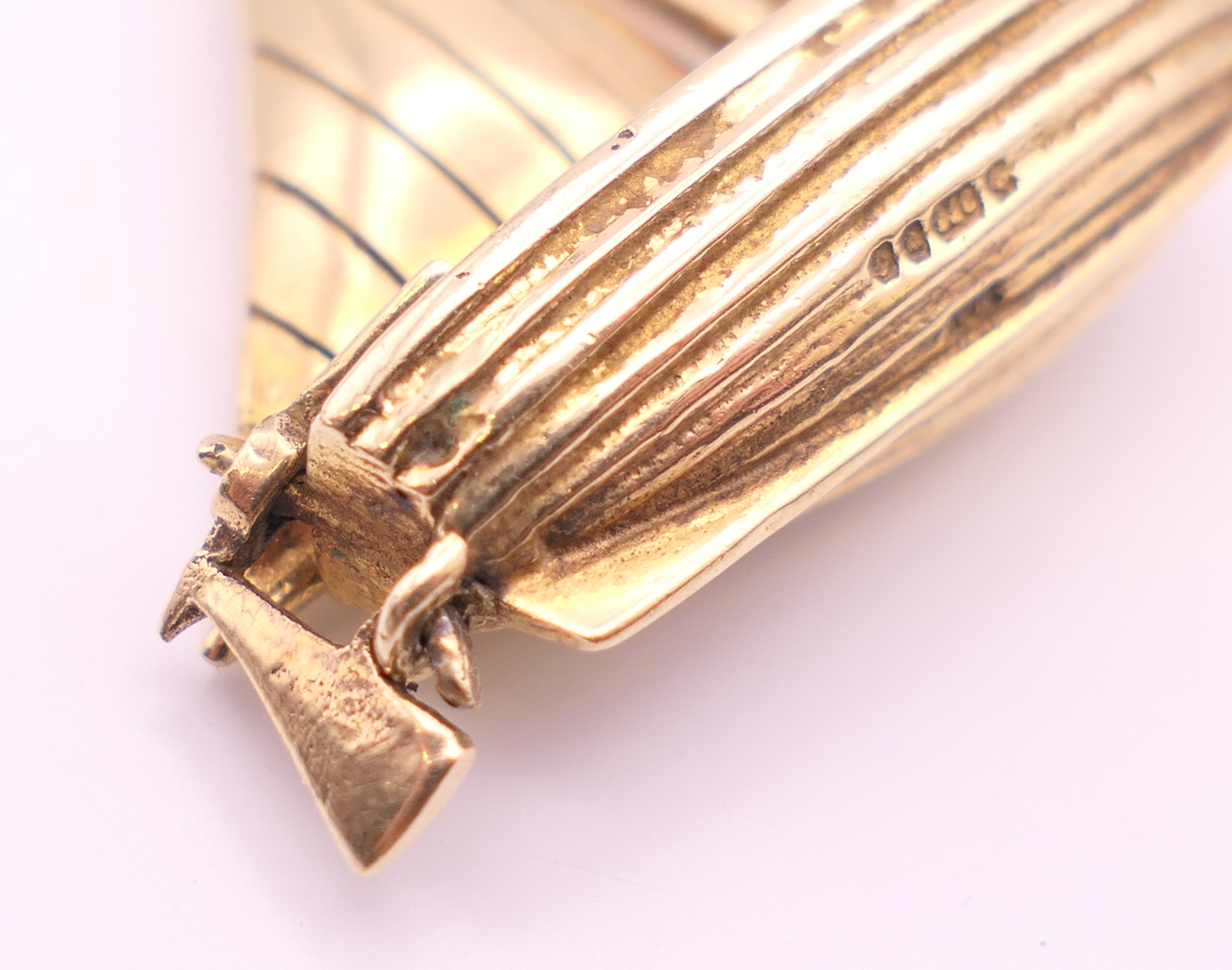 A 9 ct gold pendant formed as a sailing boat. 3 cm x 3.25 cm high. 6.9 grammes. - Image 5 of 5