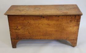 An 18th century elm coffer. 109 cm long.