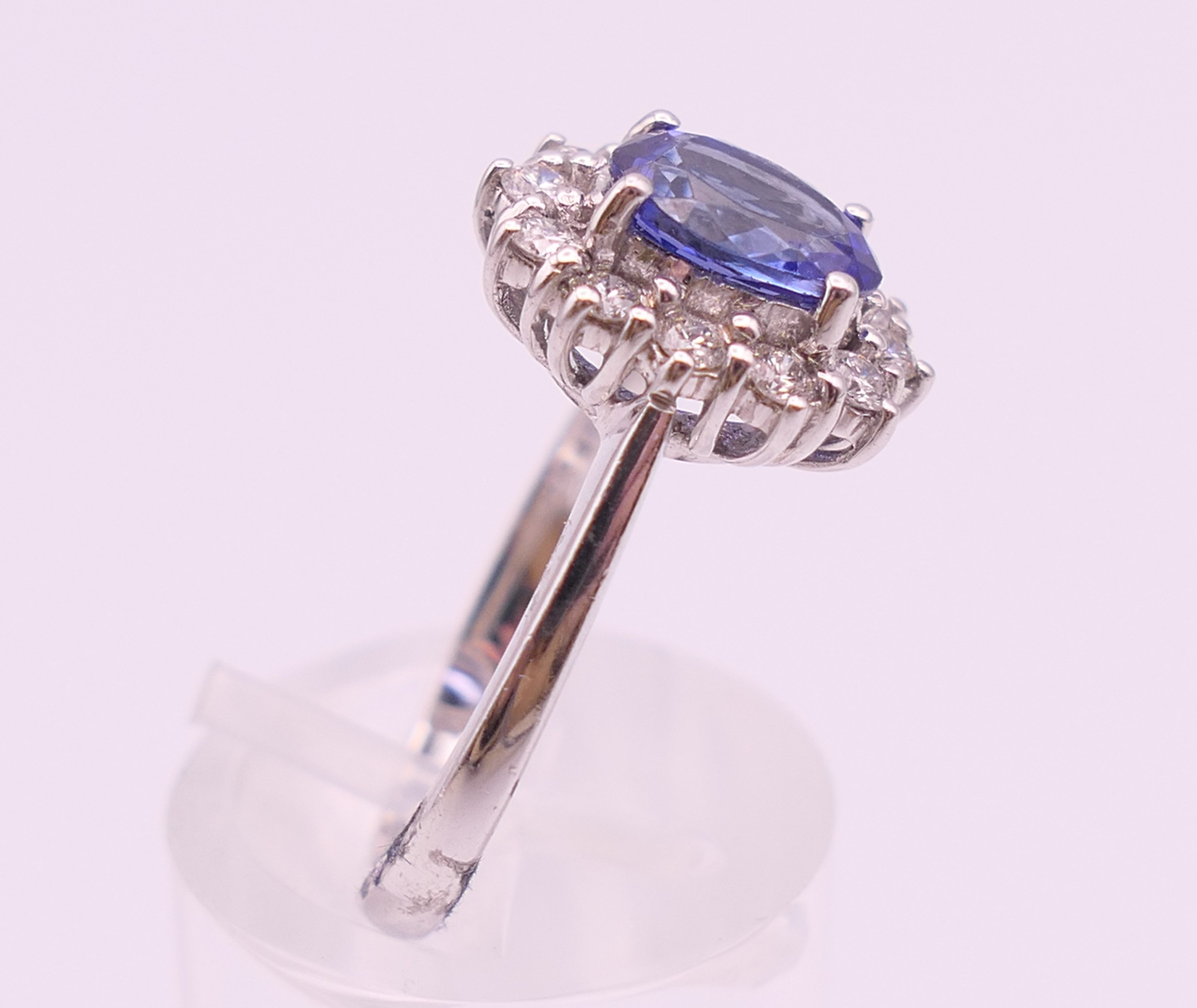 An 18 ct white gold sapphire and diamond ring. The sapphire approximately 1 carat. Ring size N. - Image 7 of 8
