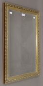 A modern wall mirror. 49 x 77.5 cm.