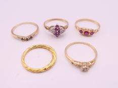 Four 9 ct gold rings and a silver gilt ring. 9.2 grammes total weight.