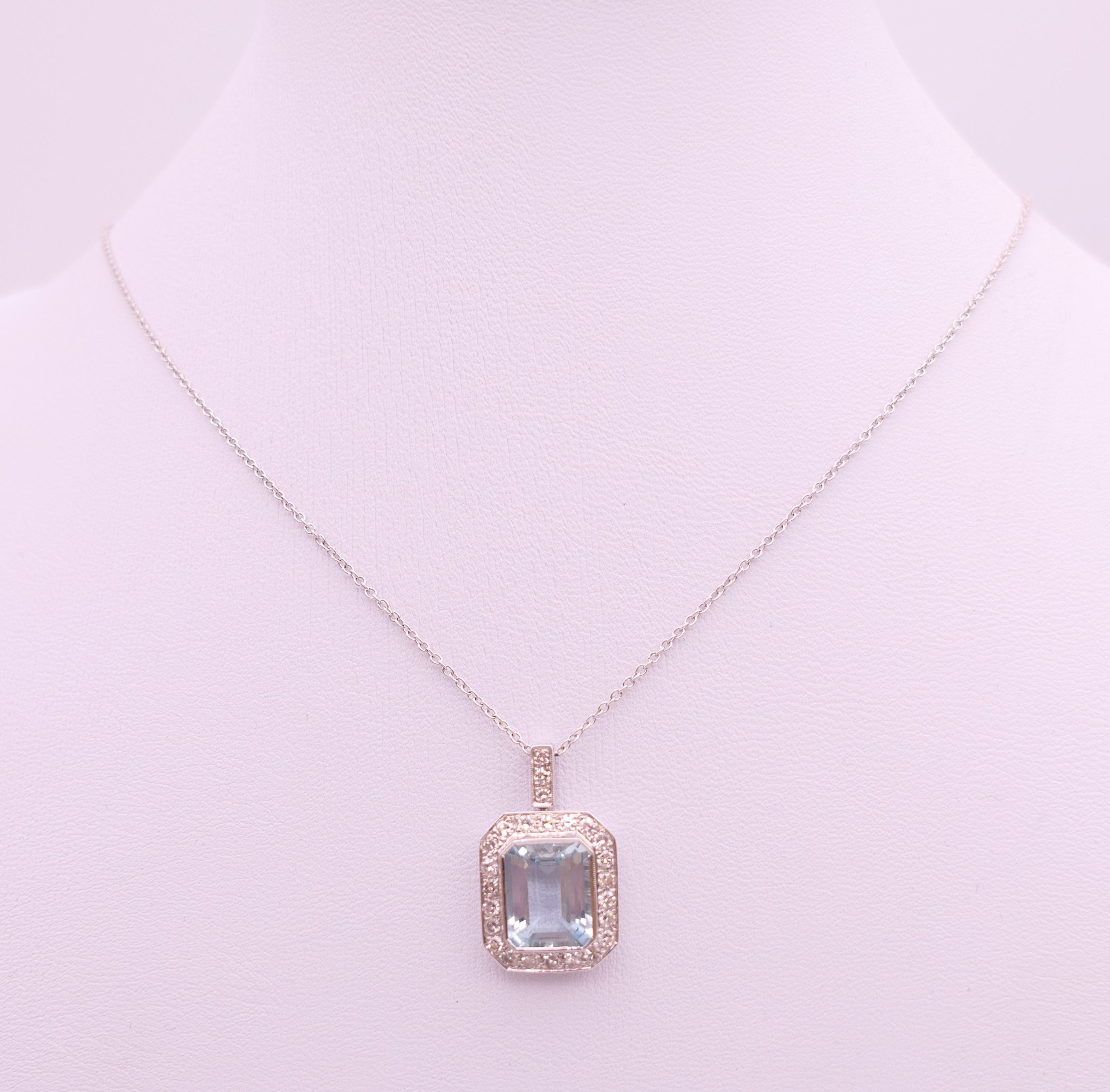 An 18 ct white gold emerald cut aquamarine and diamonds pendant on chain. - Image 2 of 6