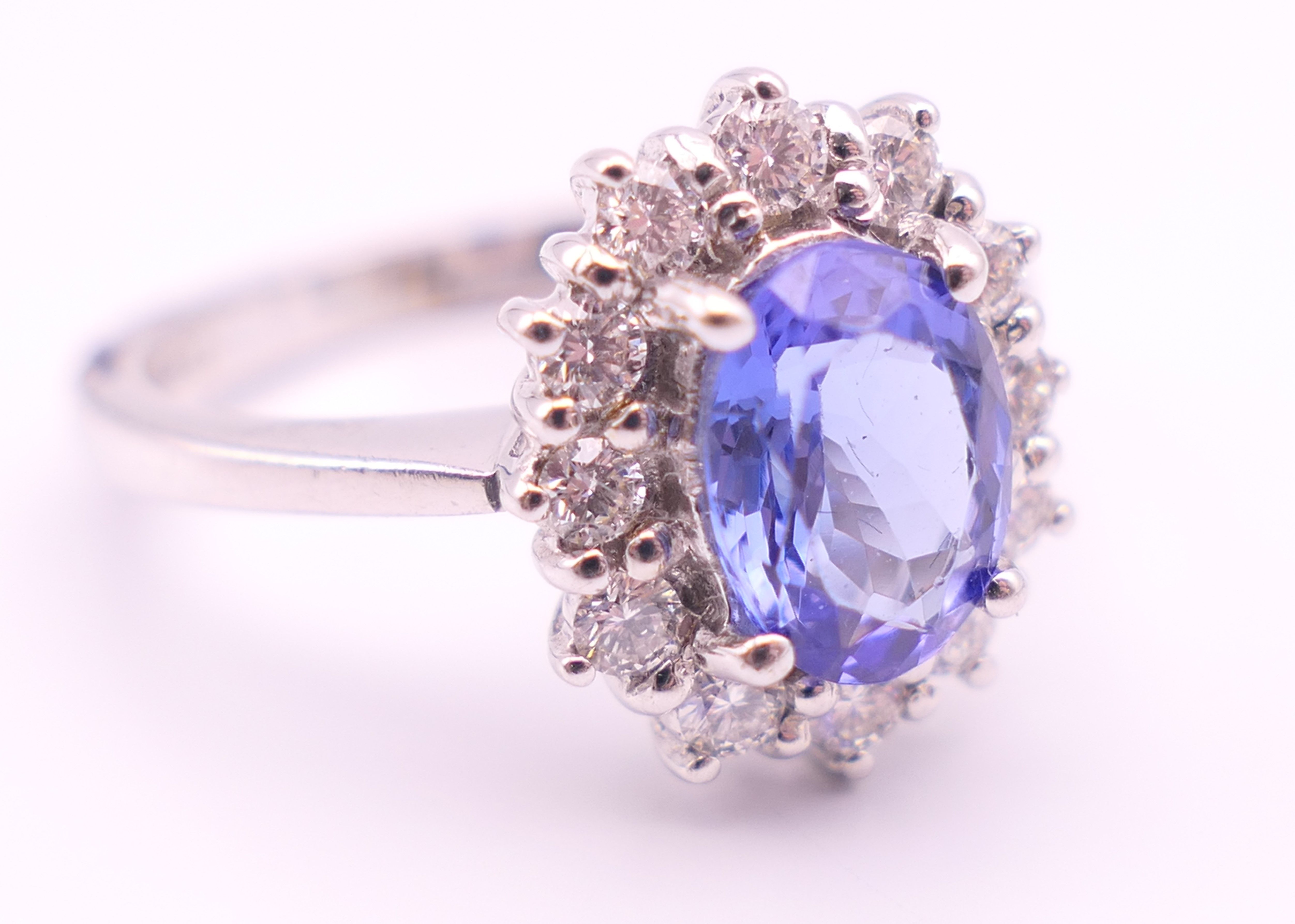 An 18 ct white gold sapphire and diamond ring. The sapphire approximately 1 carat. Ring size N. - Image 4 of 8