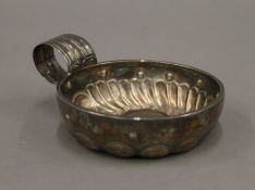 A French silver wine taster. 7.5 cm diameter. 56.3 grammes.