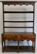 A Georgian oak pot board dresser. 134 cm wide.