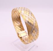 An 18 ct gold bracelet. 19 cm long. 49.9 grammes.
