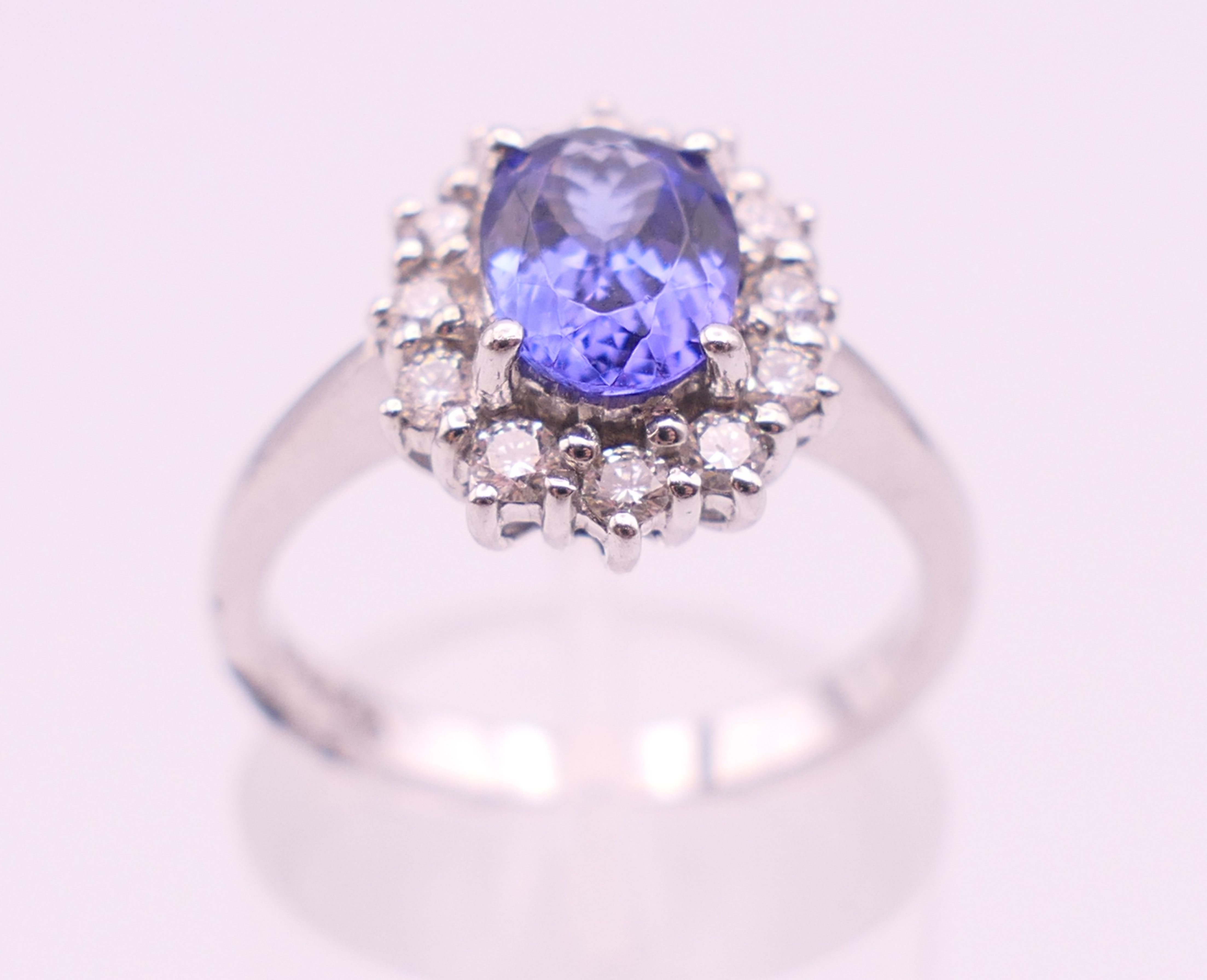 An 18 ct white gold sapphire and diamond ring. The sapphire approximately 1 carat. Ring size N. - Image 6 of 8