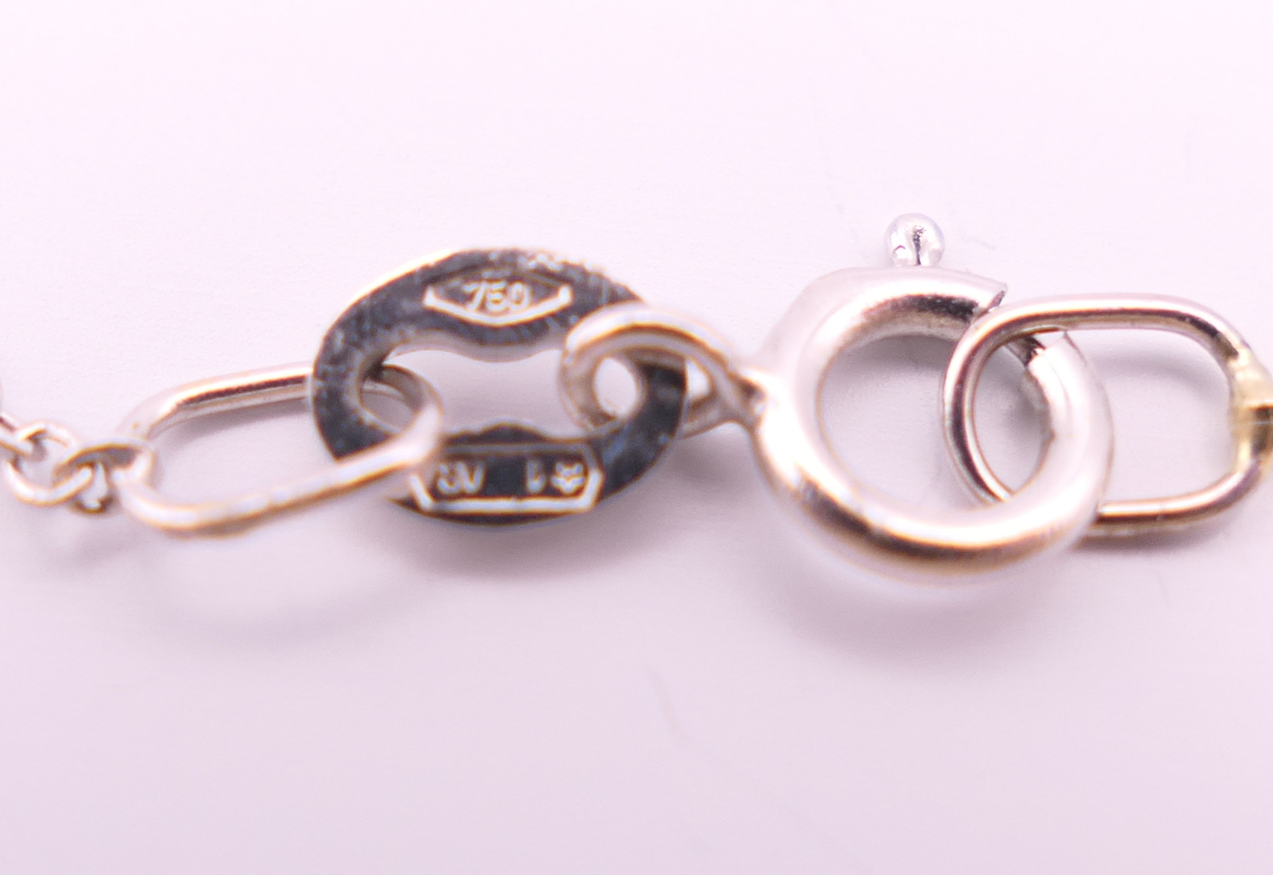 An 18 ct white gold emerald cut aquamarine and diamonds pendant on chain. - Image 5 of 6