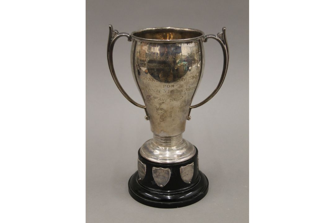A silver twin handled trophy cup on stand. 24 cm high overall. 366.8 grammes. - Image 1 of 6