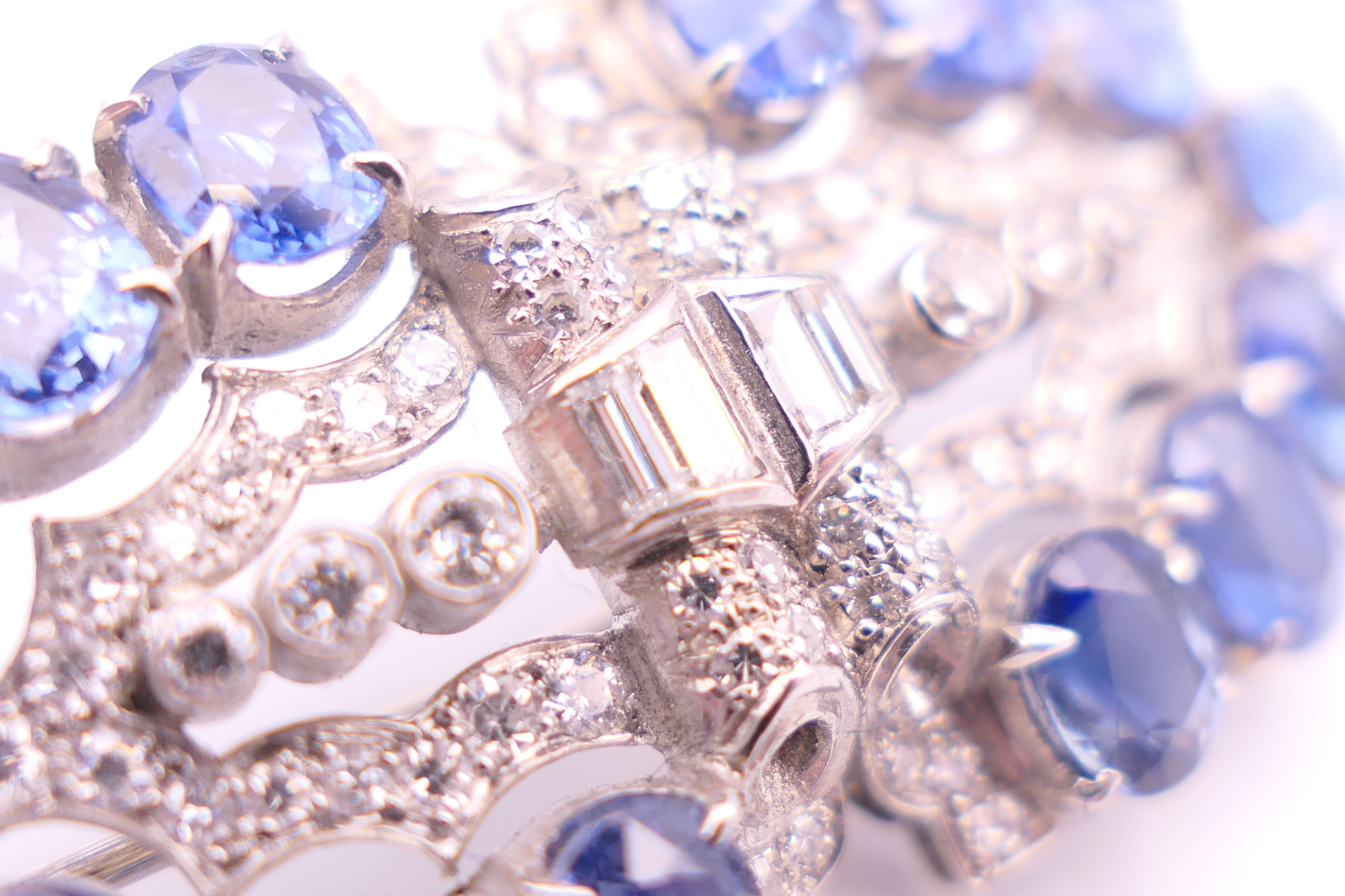 An unmarked Garrard and Co Ltd sapphire and diamond brooch, cased. 5 cm x 2 cm. - Image 8 of 19