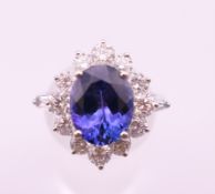 An 18 ct white gold, tanzanite and diamond ring. Tanzanite weight approximately 3.
