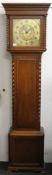 An oak barley twist longcase clock. 198 cm high.
