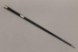 An ebony and silver stick/baton. 51.5 cm long.