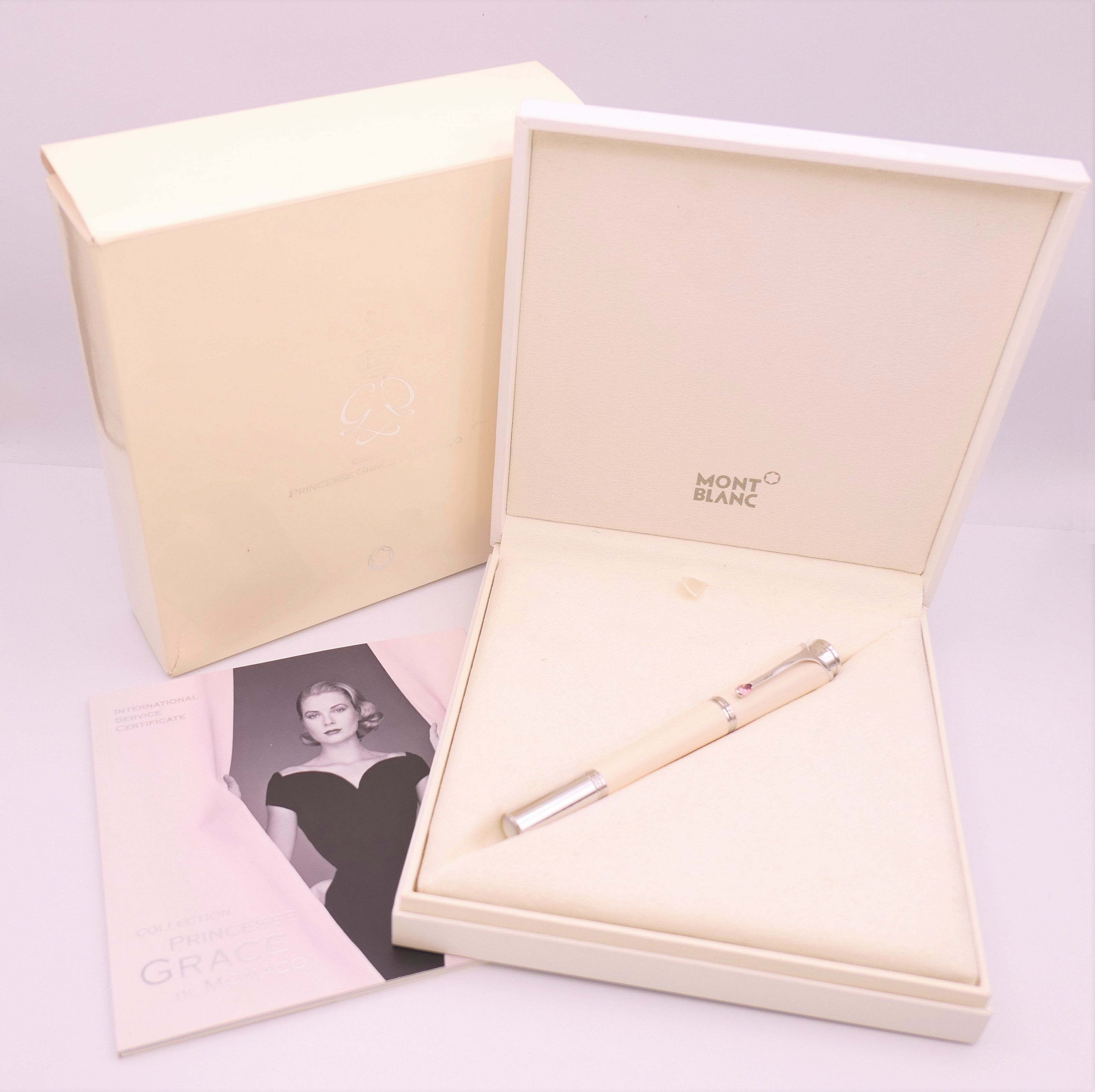 A Montblanc/Mont Blanc Princess Grace de Monaco ivory coloured rollerball pen, boxed with papers.